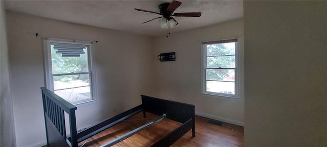 2980 Wanda Cir SW, Atlanta, GA 30315 - stairway with plenty of natural light, wood finished floors, baseboards, and ceiling fan