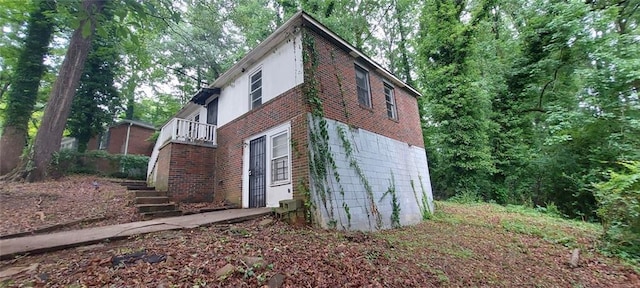 2980 Wanda Cir SW, Atlanta, GA 30315 - view of side of property featuring brick siding, stairs, and a balcony
