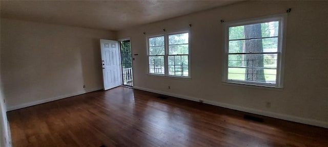 2980 Wanda Cir SW, Atlanta, GA 30315 - spare room featuring dark wood finished floors, plenty of natural light, and baseboards