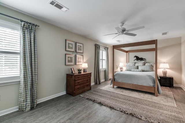 bedroom with ceiling fan and hardwood / wood-style floors