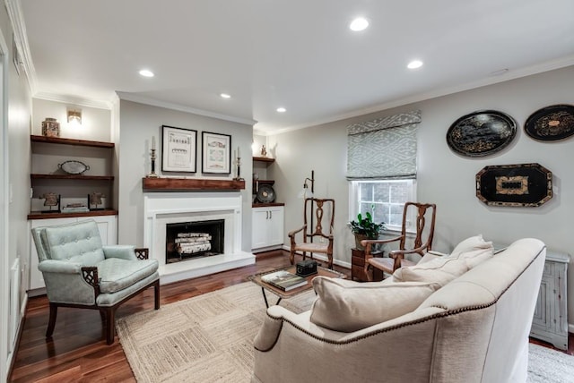 living room featuring wood-type flooring and ornamental molding