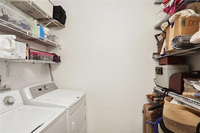 clothes washing area featuring independent washer and dryer