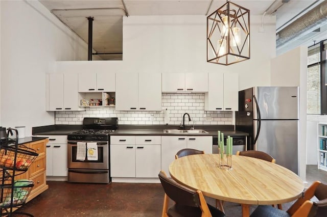 kitchen with white cabinets, sink, and stainless steel appliances