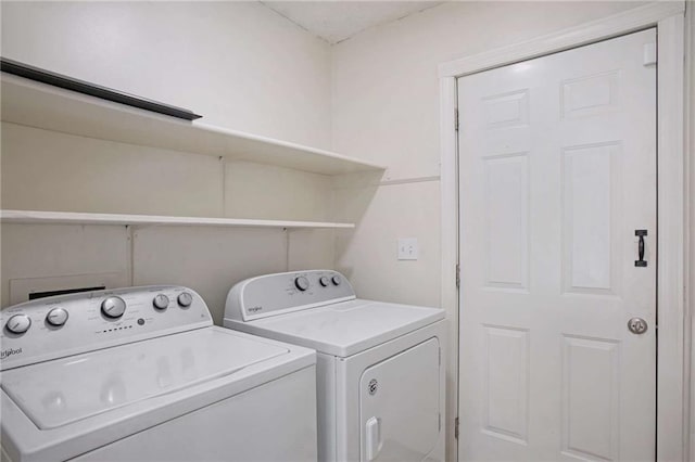 laundry area featuring washing machine and clothes dryer