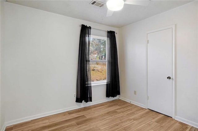 spare room with ceiling fan and light hardwood / wood-style floors