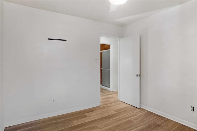 spare room featuring light hardwood / wood-style floors