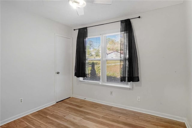 unfurnished room featuring ceiling fan and light hardwood / wood-style floors