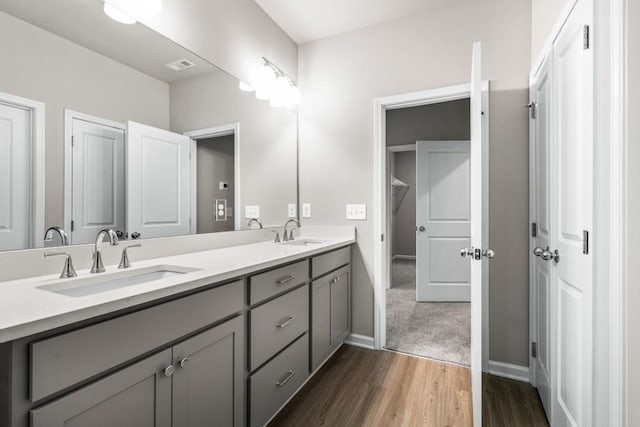 bathroom featuring vanity and hardwood / wood-style floors