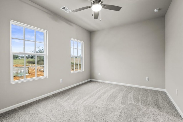 unfurnished room featuring carpet floors and ceiling fan