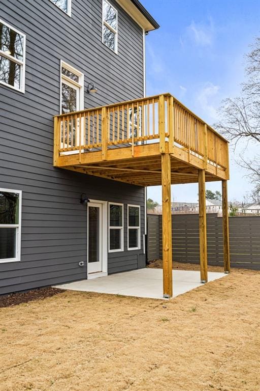 back of house with a patio and a deck