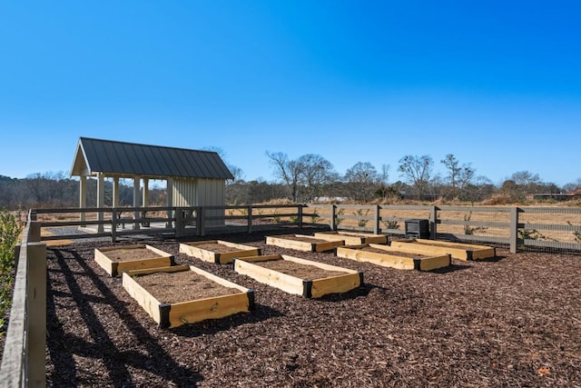 view of yard with a rural view and a storage unit