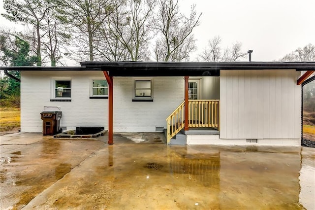 2162 Westover Dr, Atlanta, GA 30344 - back of property with brick siding and an attached carport