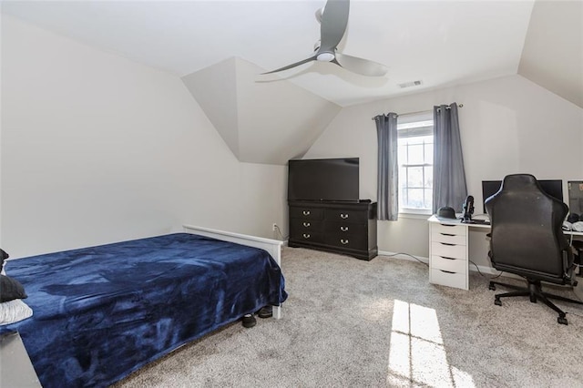 bedroom with baseboards, visible vents, a ceiling fan, light colored carpet, and vaulted ceiling