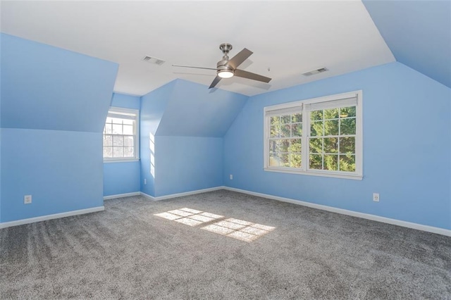 bonus room with visible vents, vaulted ceiling, and baseboards