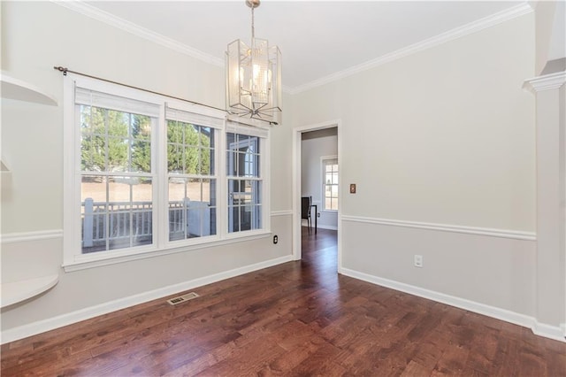 unfurnished dining area featuring visible vents, baseboards, dark wood-style floors, crown molding, and a chandelier