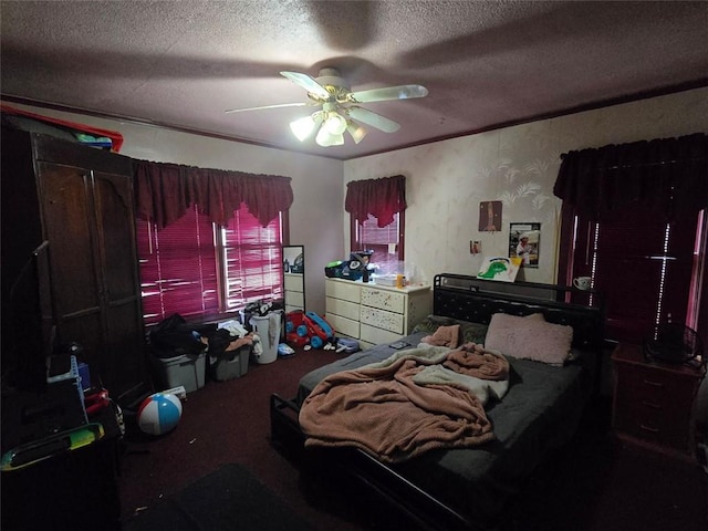 carpeted bedroom with a textured ceiling and ceiling fan