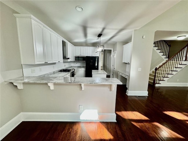 2822 Salem Oak Way, Duluth, GA 30096 - kitchen with stainless steel microwave, freestanding refrigerator, a peninsula, and dark wood finished floors