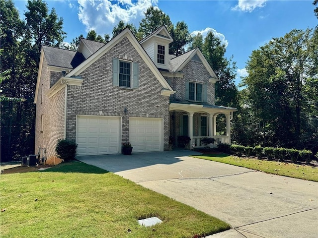 2822 Salem Oak Way, Duluth, GA 30096 - traditional home featuring a porch, driveway, a front yard, and brick siding