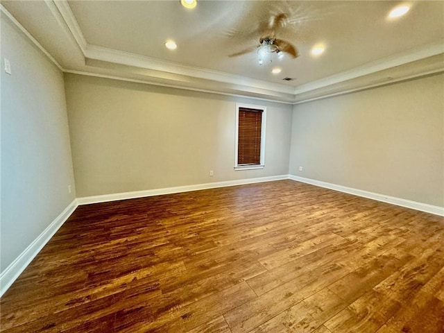 2822 Salem Oak Way, Duluth, GA 30096 - empty room with crown molding, dark wood-style floors, a raised ceiling, a ceiling fan, and baseboards