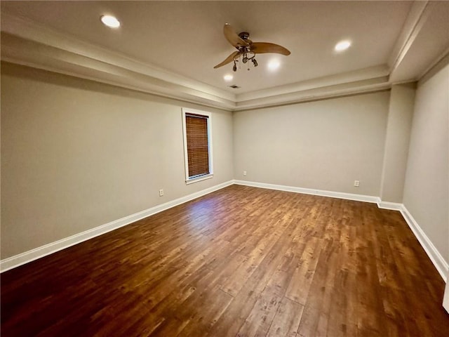 2822 Salem Oak Way, Duluth, GA 30096 - spare room with a raised ceiling, dark wood-type flooring, a ceiling fan, baseboards, and ornamental molding