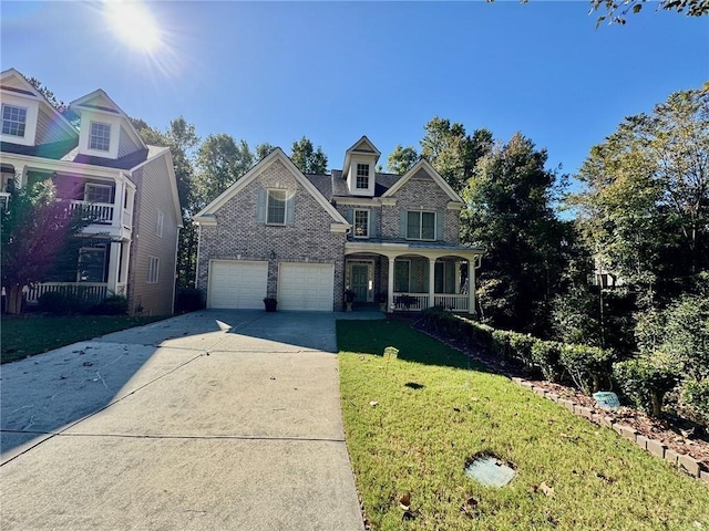 2822 Salem Oak Way, Duluth, GA 30096 - traditional-style house featuring covered porch, driveway, a front lawn, and a garage