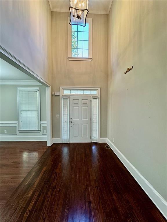2822 Salem Oak Way, Duluth, GA 30096 - entrance foyer featuring a high ceiling, a chandelier, wood finished floors, crown molding, and baseboards