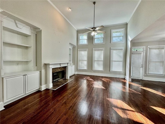 2822 Salem Oak Way, Duluth, GA 30096 - unfurnished living room featuring crown molding, a ceiling fan, a high end fireplace, wood finished floors, and built in shelves