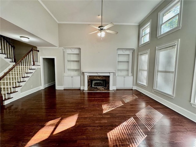 2822 Salem Oak Way, Duluth, GA 30096 - unfurnished living room featuring a high ceiling, ornamental molding, a ceiling fan, built in shelves, and baseboards