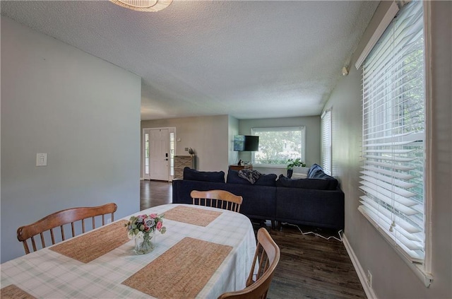 1837 Lochlomand Ln SE, Smyrna, GA 30080 - dining area with a textured ceiling, wood finished floors, and baseboards