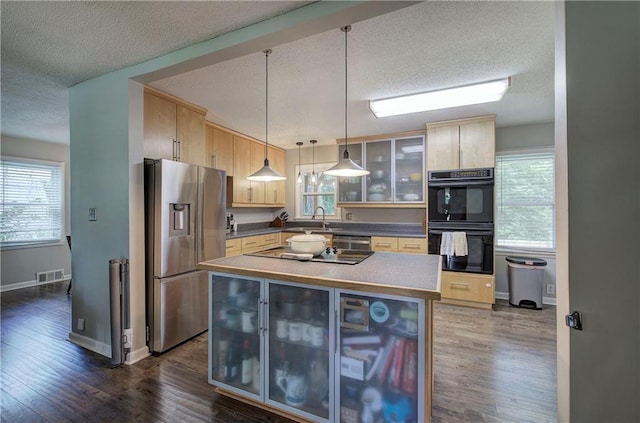 1837 Lochlomand Ln SE, Smyrna, GA 30080 - kitchen with black appliances, a textured ceiling, light brown cabinetry, wine cooler, and plenty of natural light