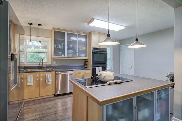 1837 Lochlomand Ln SE, Smyrna, GA 30080 - kitchen with black appliances, a sink, wood finished floors, a textured ceiling, and glass insert cabinets