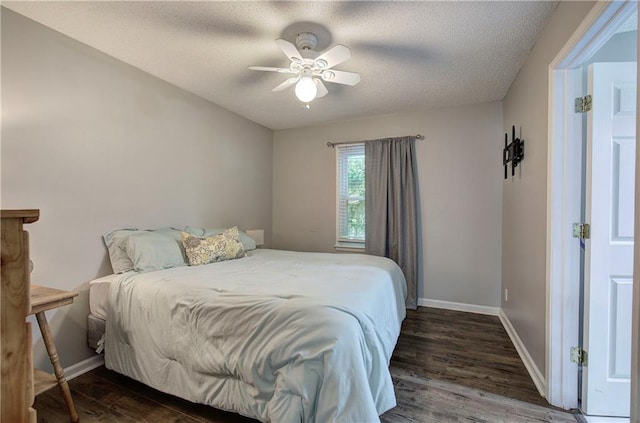 1837 Lochlomand Ln SE, Smyrna, GA 30080 - bedroom with wood finished floors, baseboards, ceiling fan, and a textured ceiling