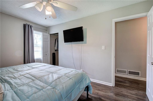 1837 Lochlomand Ln SE, Smyrna, GA 30080 - bedroom featuring a textured ceiling, wood finished floors, baseboards, a closet, and ceiling fan