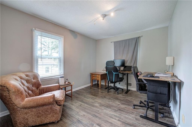 1837 Lochlomand Ln SE, Smyrna, GA 30080 - home office with wood finished floors, a textured ceiling, and baseboards