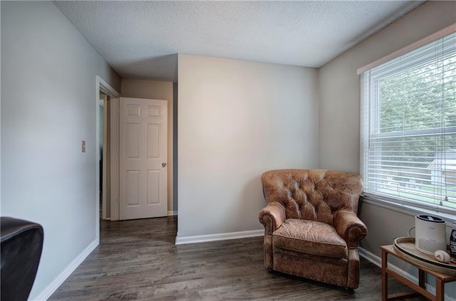 1837 Lochlomand Ln SE, Smyrna, GA 30080 - living area with wood finished floors, a textured ceiling, and baseboards