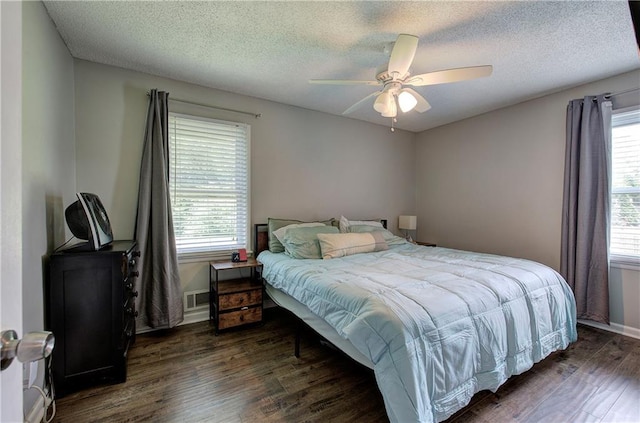 1837 Lochlomand Ln SE, Smyrna, GA 30080 - bedroom with wood finished floors, a textured ceiling, a ceiling fan, and baseboards