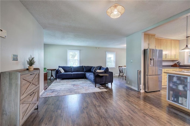 1837 Lochlomand Ln SE, Smyrna, GA 30080 - living area featuring wine cooler, a textured ceiling, dark wood finished floors, and baseboards