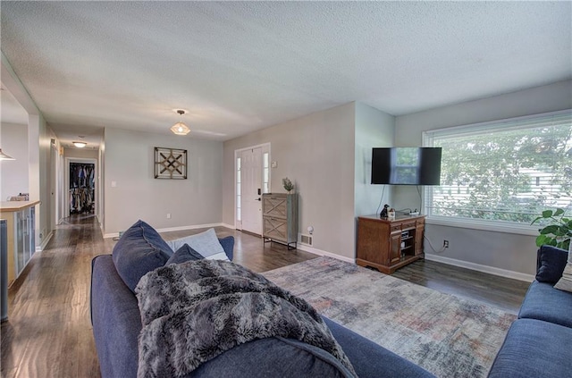 1837 Lochlomand Ln SE, Smyrna, GA 30080 - living area with a textured ceiling, wood finished floors, and baseboards