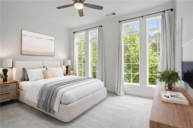 carpeted bedroom with ceiling fan