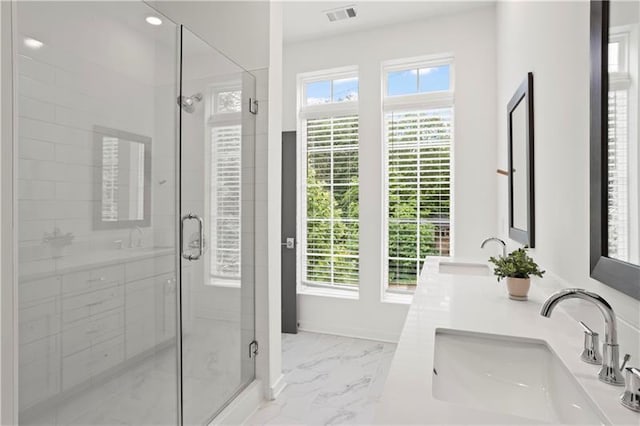 bathroom with vanity and an enclosed shower