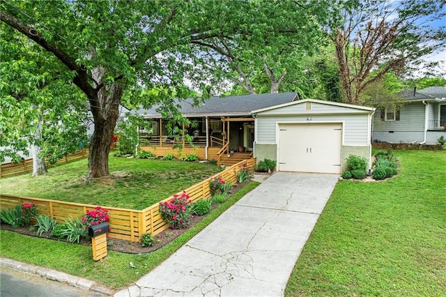 single story home featuring brick siding, fence, a garage, concrete driveway, and a front yard