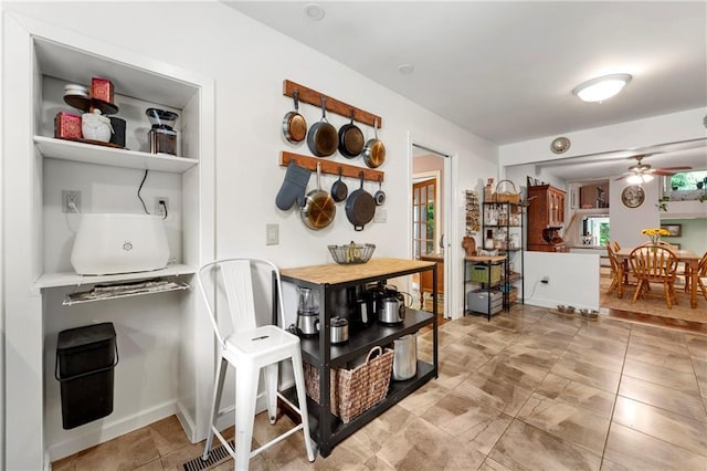 dining room featuring a ceiling fan and light tile patterned flooring