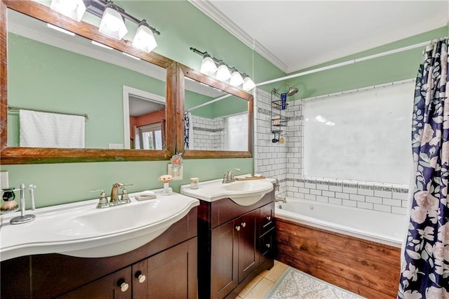 bathroom with a sink, tile patterned flooring, two vanities, and crown molding