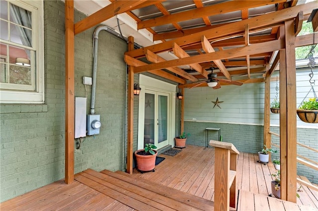 wooden deck featuring a ceiling fan