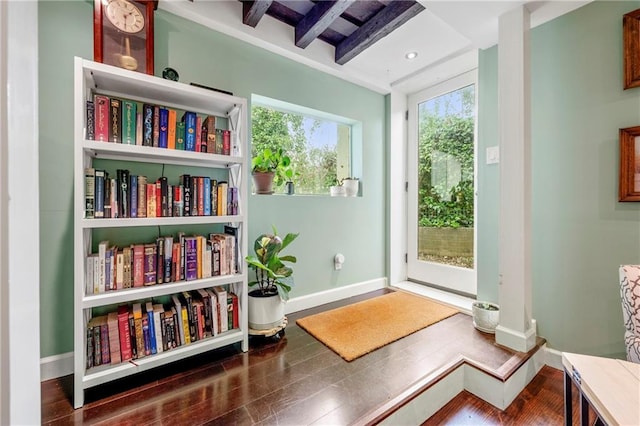 sitting room featuring baseboards and wood finished floors