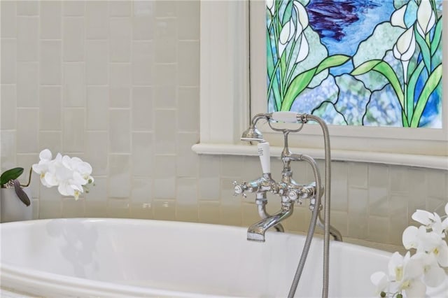 bathroom with a tub to relax in