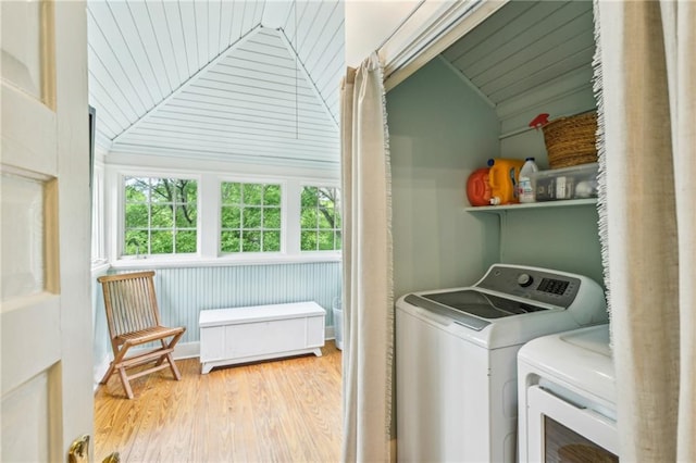 laundry area featuring wood ceiling, laundry area, independent washer and dryer, and wood finished floors