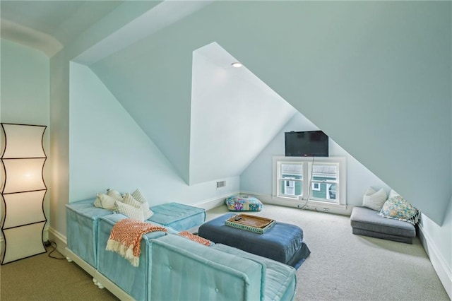 carpeted bedroom with baseboards, visible vents, and lofted ceiling
