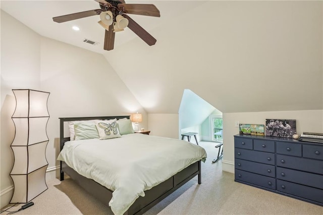 bedroom featuring ceiling fan, light colored carpet, baseboards, vaulted ceiling, and visible vents