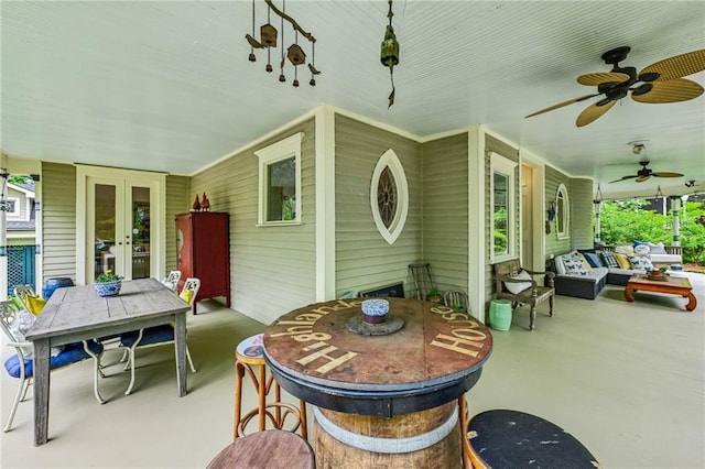view of patio / terrace featuring french doors, a ceiling fan, outdoor dining area, and outdoor lounge area